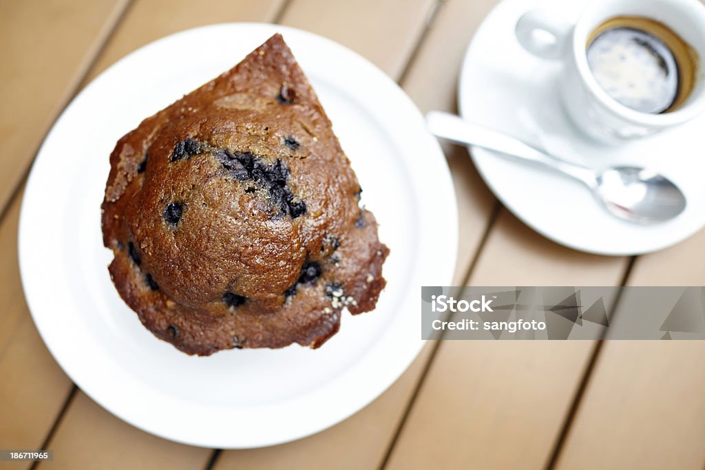 Blueberry muffin with espresso drink on table top view Blueberry muffin with espresso drink on table top view. Baked Stock Photo
