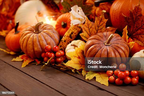 Autumn Decoration With Maple Leaves And Pumpkins On Old Woods Stock Photo - Download Image Now