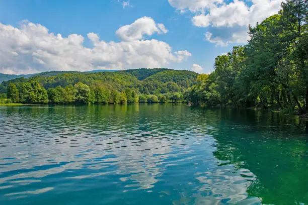 The River Una as it flows past the Japod Islands, or Japodski Otoci, near Bihac in the Una National Park. Una-Sana Canton, Federation of Bosnia and Herzegovina. Early September