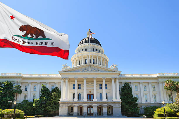 California state flag flying in front of capital building Sacramento California outside capital building sacramento photos stock pictures, royalty-free photos & images