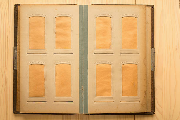 an old photo album page with retro corner holders and textured paper background