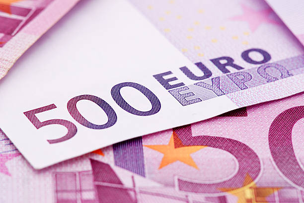 Cash euros money on white background in close up