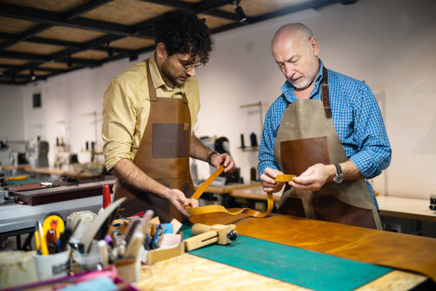 istock At the leather workshop, father and son working together 1867169686