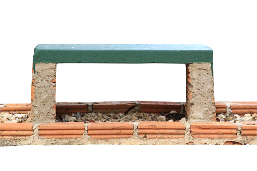 Bench made of cement, brick block base isolated on white background with clipping path.