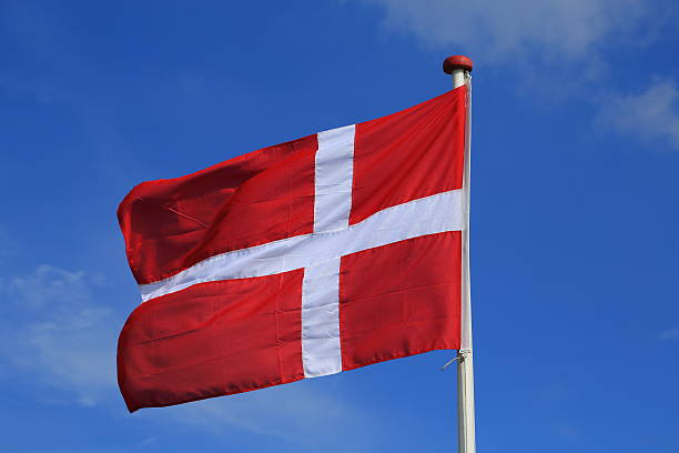 istock Dannebrog the flag of Denmark on blue sky 186719632