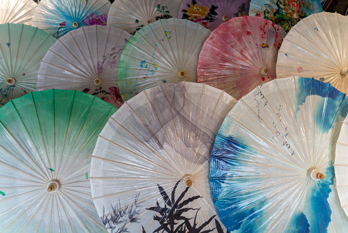 Colorful umbrellas - souvenirs  for sale on night market in Luang Prabang, Laos