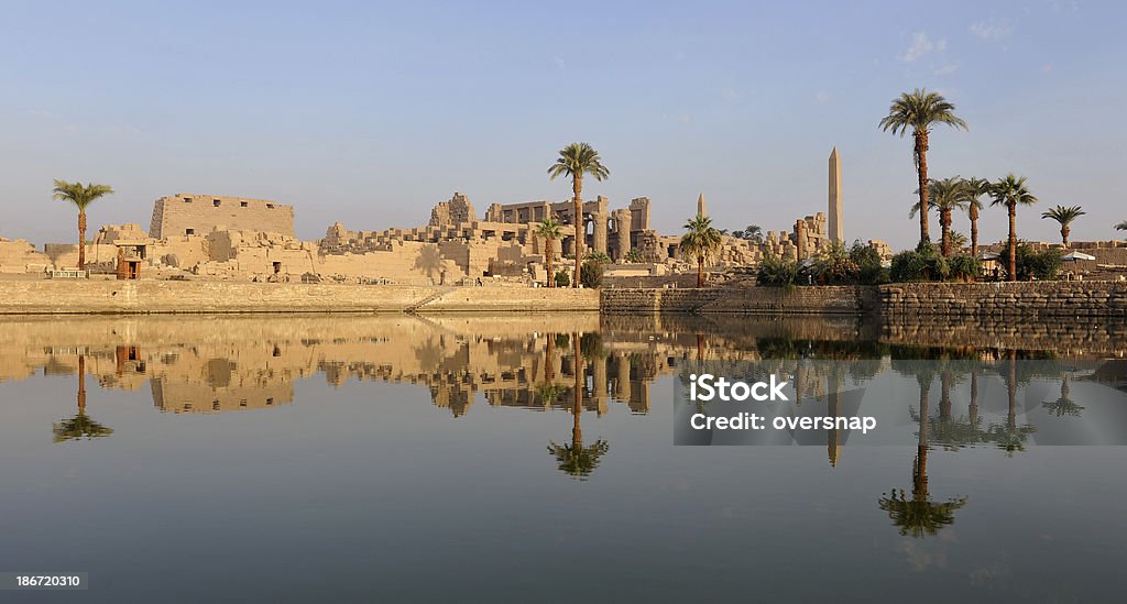 Ancient Egyptian Panorama The Ancient (four thousand years old) Egyptian temple complex at Karnak - reflected at dawn Nile River Stock Photo