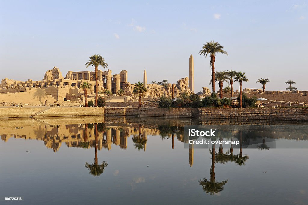Ancient Nile temples The Ancient (four thousand years old) Egyptian temple complex at Karnak - reflected at dawn Temples of Karnak Stock Photo