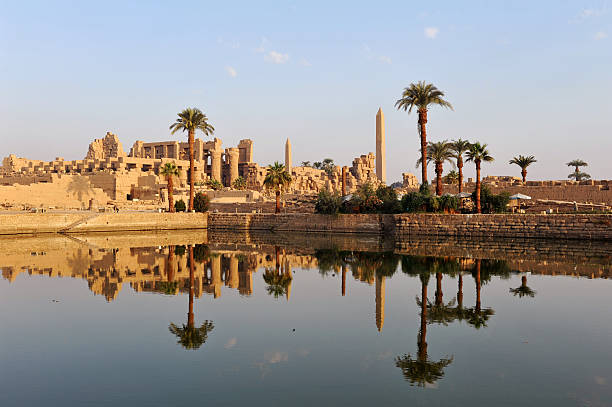 Ancient Nile temples The Ancient (four thousand years old) Egyptian temple complex at Karnak - reflected at dawn nile river stock pictures, royalty-free photos & images