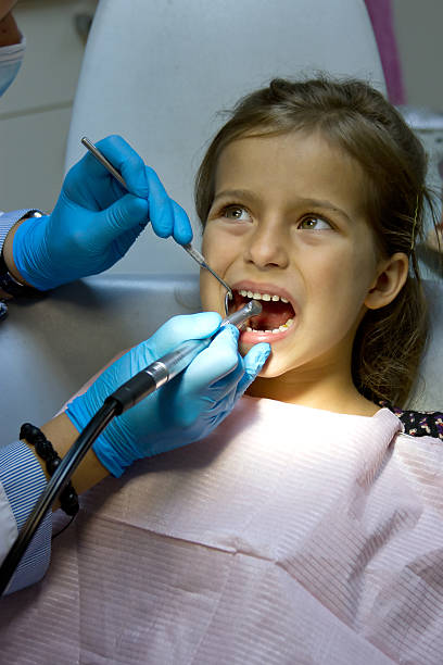 istock girl at the dentist. 186720917