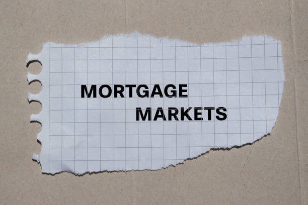 istock Mortgage markets lettering on ripped paper 1867228917