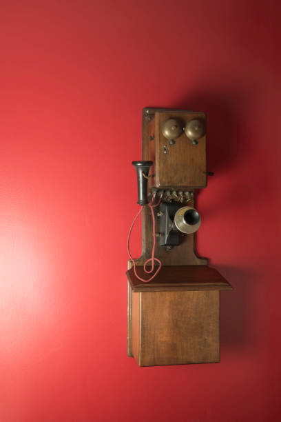 istock Retro style, landline telephone on a red wall. 1867232148