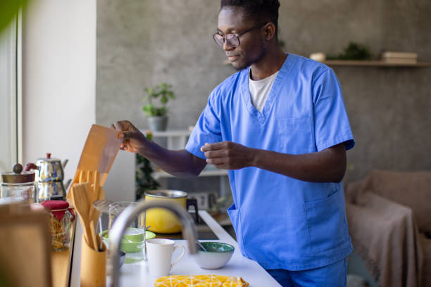 istock Young male nurse making himself breakfast at home 1867233253