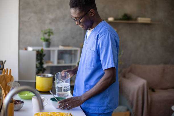 istock Young male nurse making himself breakfast at home 1867233680