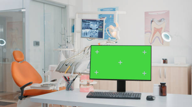 istock Nobody in stomatology office with green screen on computer 1867233770