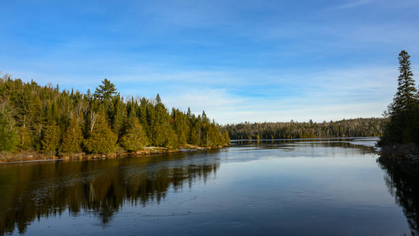 istock Algonquin Pronvincial Park in late autumn - tree reflections on small lake 1867237267