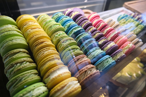 Traditional french macaron in rows on display at cafe