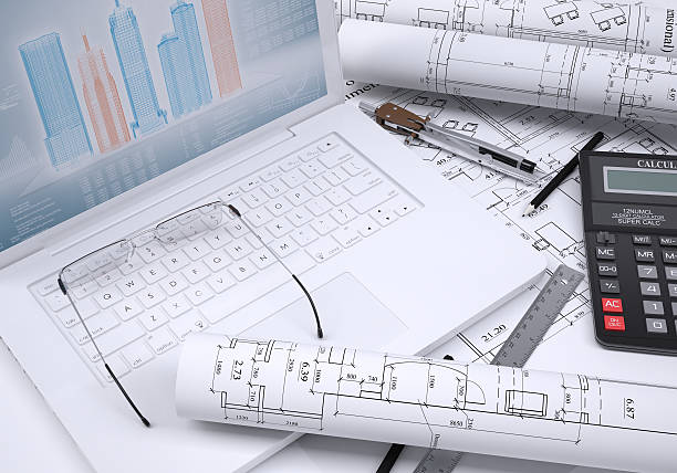 Calculator, paper and laptop