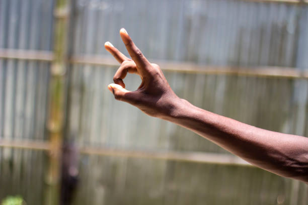 istock A man with two fingers pointing upwards on his hand and blurred background 1867247883