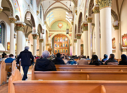 Santa Fe, NM: A crowd in the pews in St Francis Cathedral during a Christmas concert.