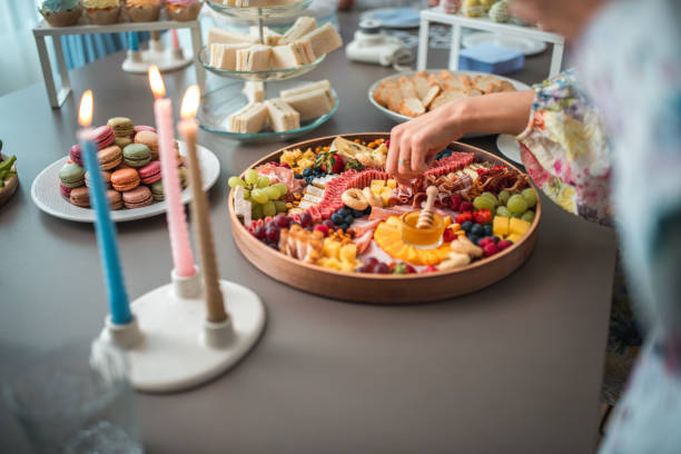 istock Diverse Gourmet Charcuterie Board at Cozy Gathering 1867268512