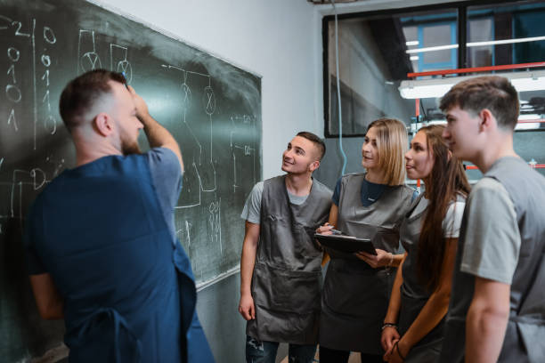istock Chalkboard Explanation Of PLC Devices By Bearded Teacher During Class 1867269646