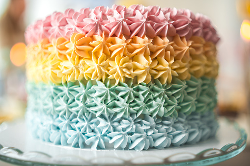 Beautiful colorful and delicious cake at a baby shower celebration displayed on a tray.