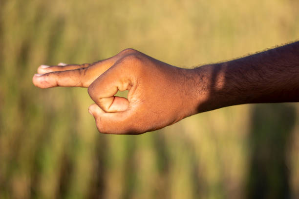 istock A man has three fingers on his hand pointing forward and blurred background 1867276105