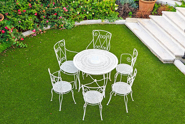 Open summer patio Open summer patio with white wrought iron furniture wrought iron stock pictures, royalty-free photos & images
