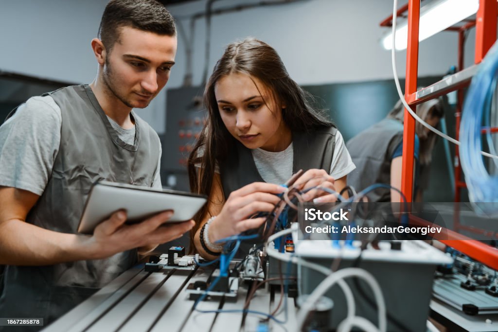 Engineering Students Learning About Diagrams To Connect Plc Devices ...