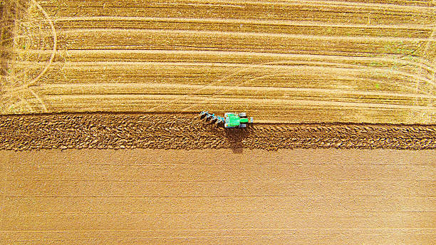 istock aerial view of tractor plowing a field 186729297
