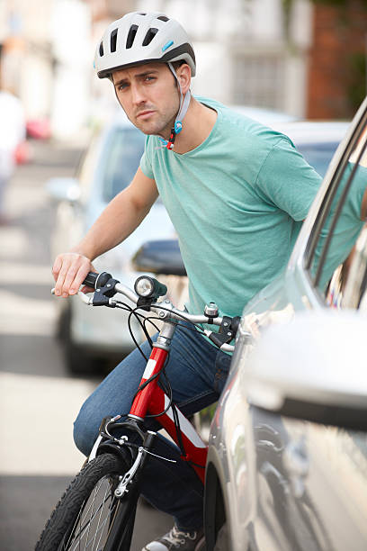 istock Young Man Cycling On Urban Street 186729330