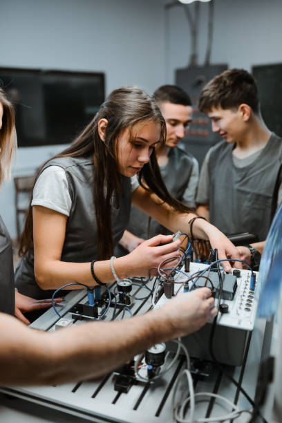 istock Female Student Showing Proficiency In Operating PLC Devices 1867301260