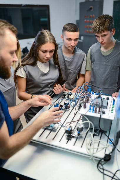 istock Students Learning About Movement Of Mini Productions Lines Operated By PLC 1867309052