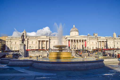 London, UK. November 28 2023. Exterior daytime view of the National Gallery and fountains in Trafalgar Square