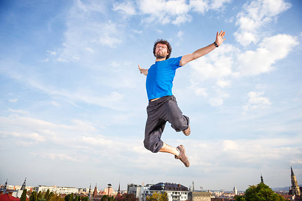 cheio de energia - men businessman jumping levitation imagens e fotografias de stock