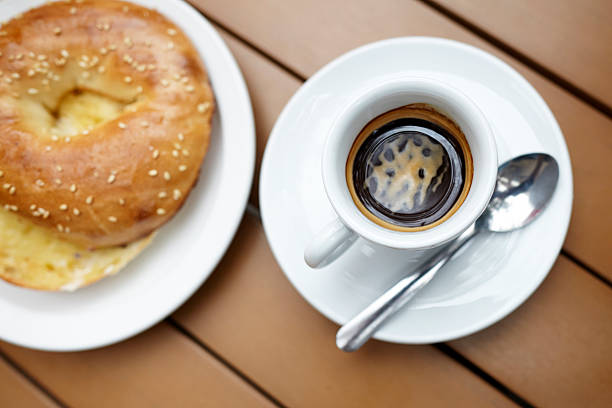 istock Espresso drink with bagel sliced close-up top view 186735466