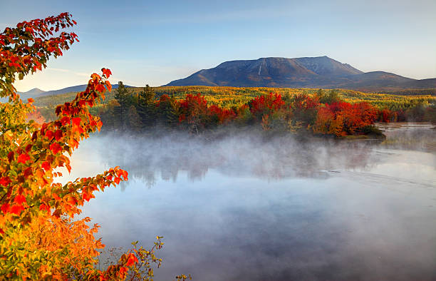 Mount Katahdin near Baxter State Park in Maine Mount Katahdin is the highest mountain in Maine. Katahdin is the centerpiece of Baxter State Park: a steep, tall mountain formed from underground magma. Photo taken during the autumn foliage season. Maine fall foliage ranks with the best in New England bringing out some of  the most beautiful foliage in the United States mt katahdin stock pictures, royalty-free photos & images