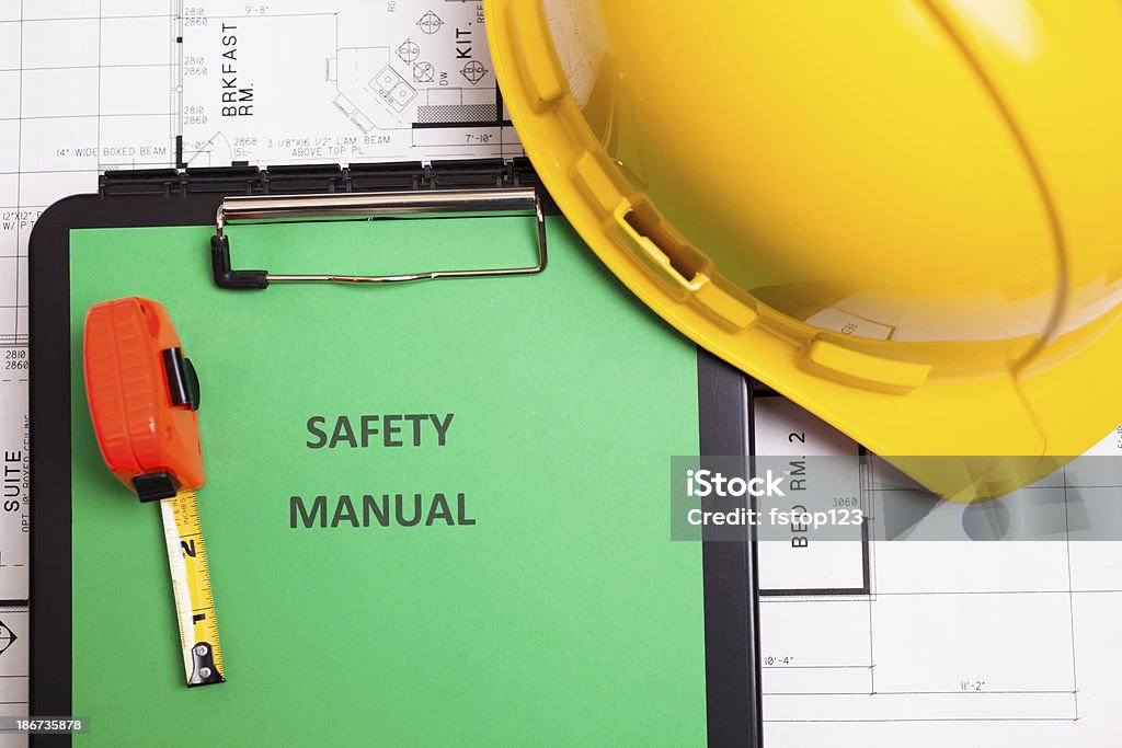 Construção: manual de segurança e workman'Ferramentas em houseplans. - Foto de stock de Acidente royalty-free