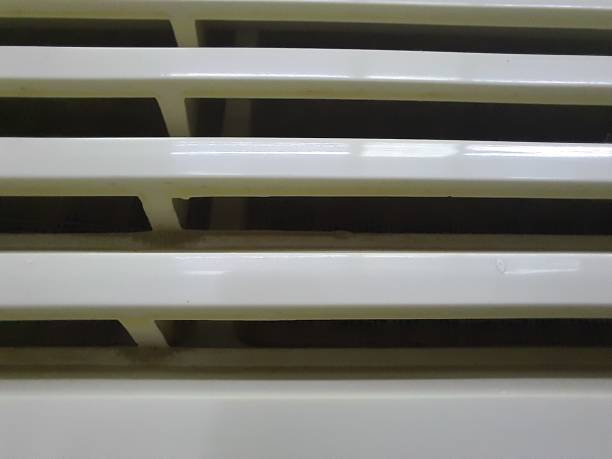 istock An old styled white electric air conditioner, close-up view 1867393326