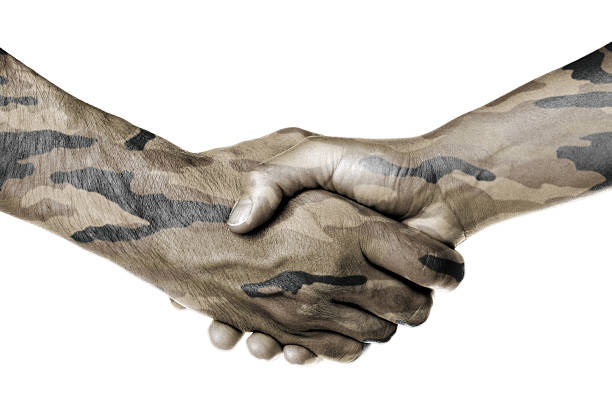 istock Man and woman shaking hands 186740699