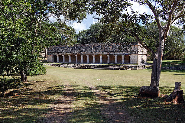 Colonnade Structure at Uxmal Mexico Colonnade columns structure next to the Pyramid of the Magician at the archeological site of Uxmal on the Yucatan Peninsula near Merida, Mexico. uxmal stock pictures, royalty-free photos & images