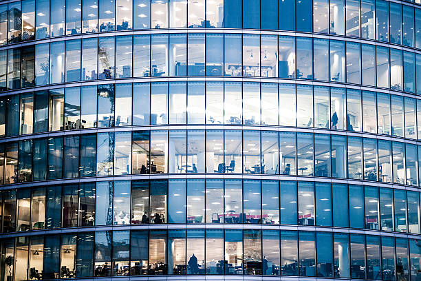 Office buildings in the night Office buildings in the night in London, UK. bustling city stock pictures, royalty-free photos & images