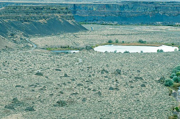 istock Dirt road through canyon under Dry Falls in central Washington 186743613