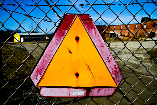 Close-up of Weathered Warning Sign on Chain-Link Fence in Industrial Area, Pierceton, Indiana