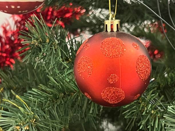 istock festive Christmas ornament hanging on tree branches 1867448059