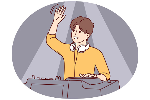 Male DJ waving to greet club goers and cheer up dancing people. Guy with headphones around neck stands behind mixing console while controlling music at party. Flat vector illustration