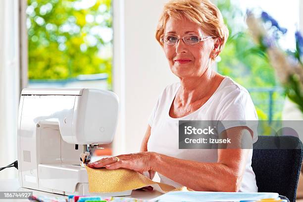 Woman Sewing At Home Stock Photo - Download Image Now - 60-64 Years, Active Lifestyle, Active Seniors
