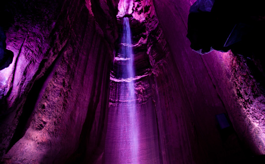 Dramatic lighting on the underground waterfall in the caves of Chattanooga