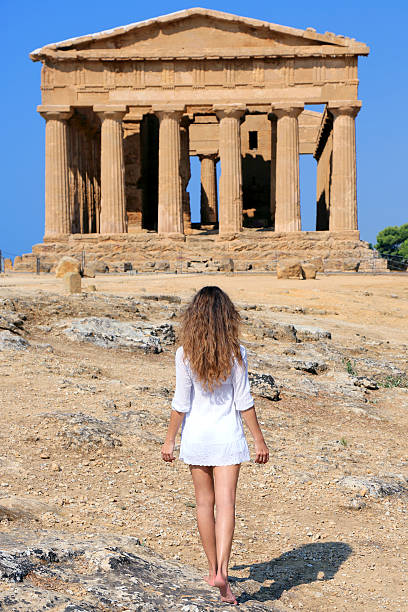 istock Young woman in front of old temple 186745080